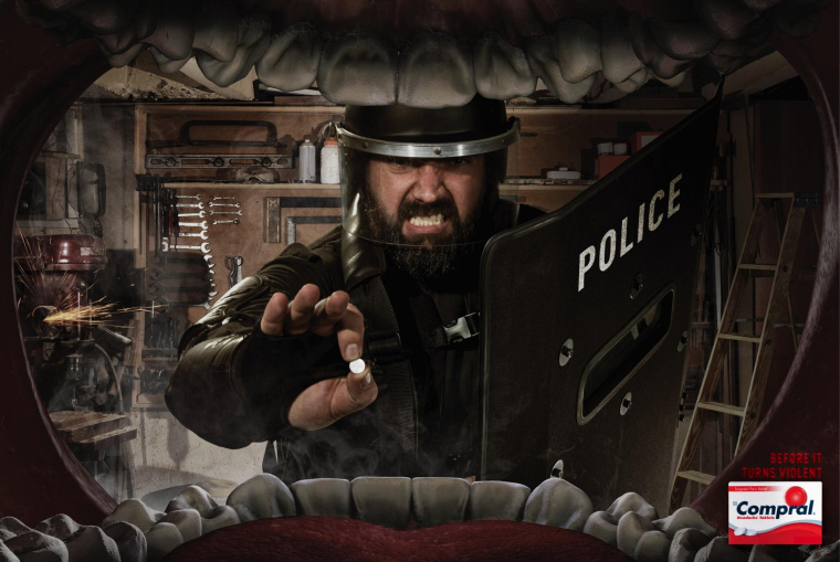 Compral 頭疼藥平面廣告創意設計“大嘴吃藥篇暴力性頭痛”-上海藥品平面廣告策劃設計公司