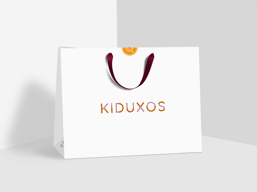 KIDUXOS兒童商店品牌logo設計vi設計與店鋪空間設計