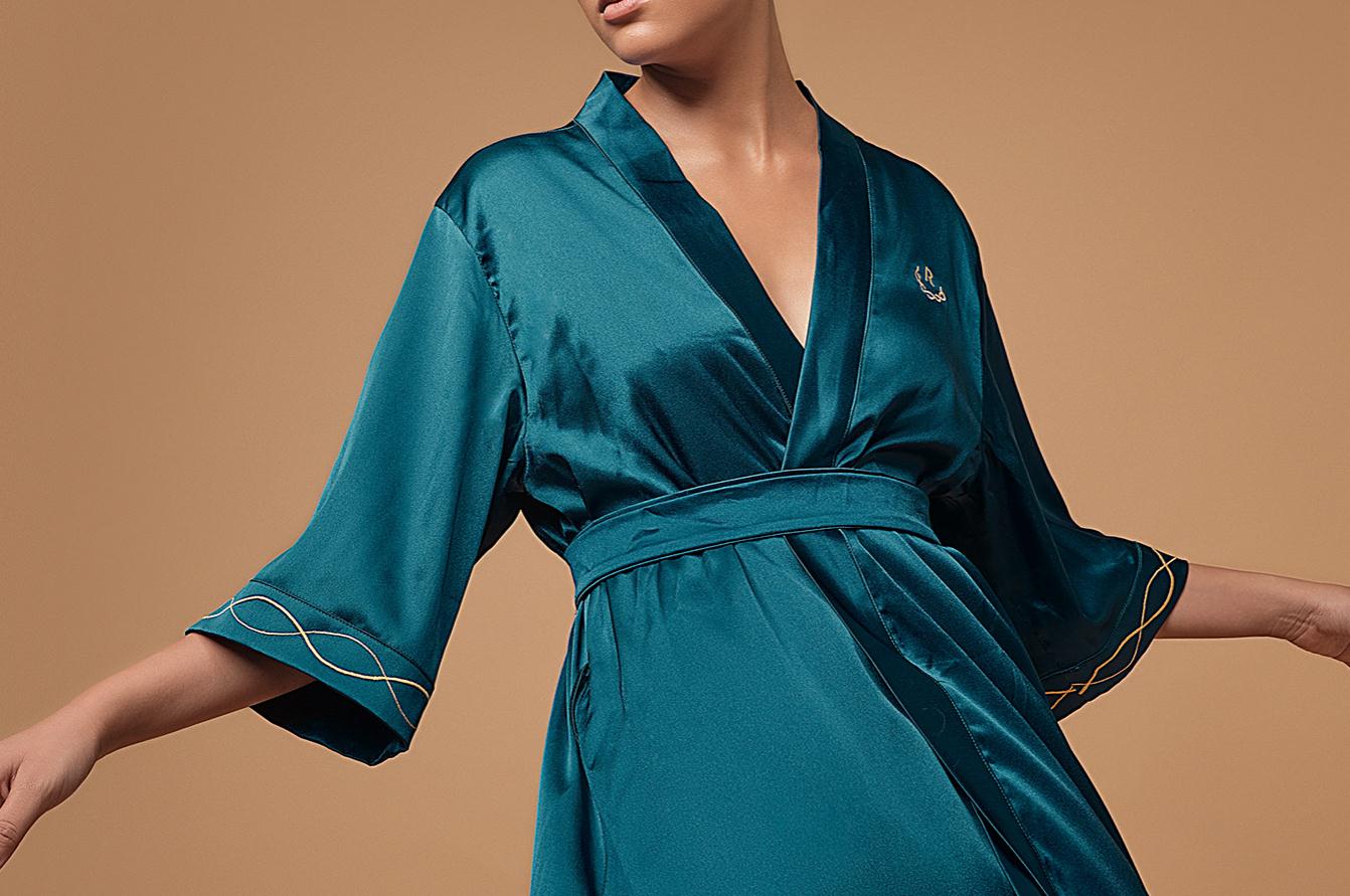 Ruco非手術美容與皮膚護理醫療logo設計vi設計。青黑色金色奢侈風與循環交叉線條-制服設計